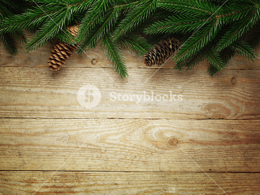 Christmas fir tree with decoration on a wooden board