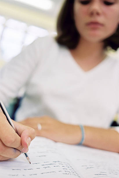 Girl writing with a pen